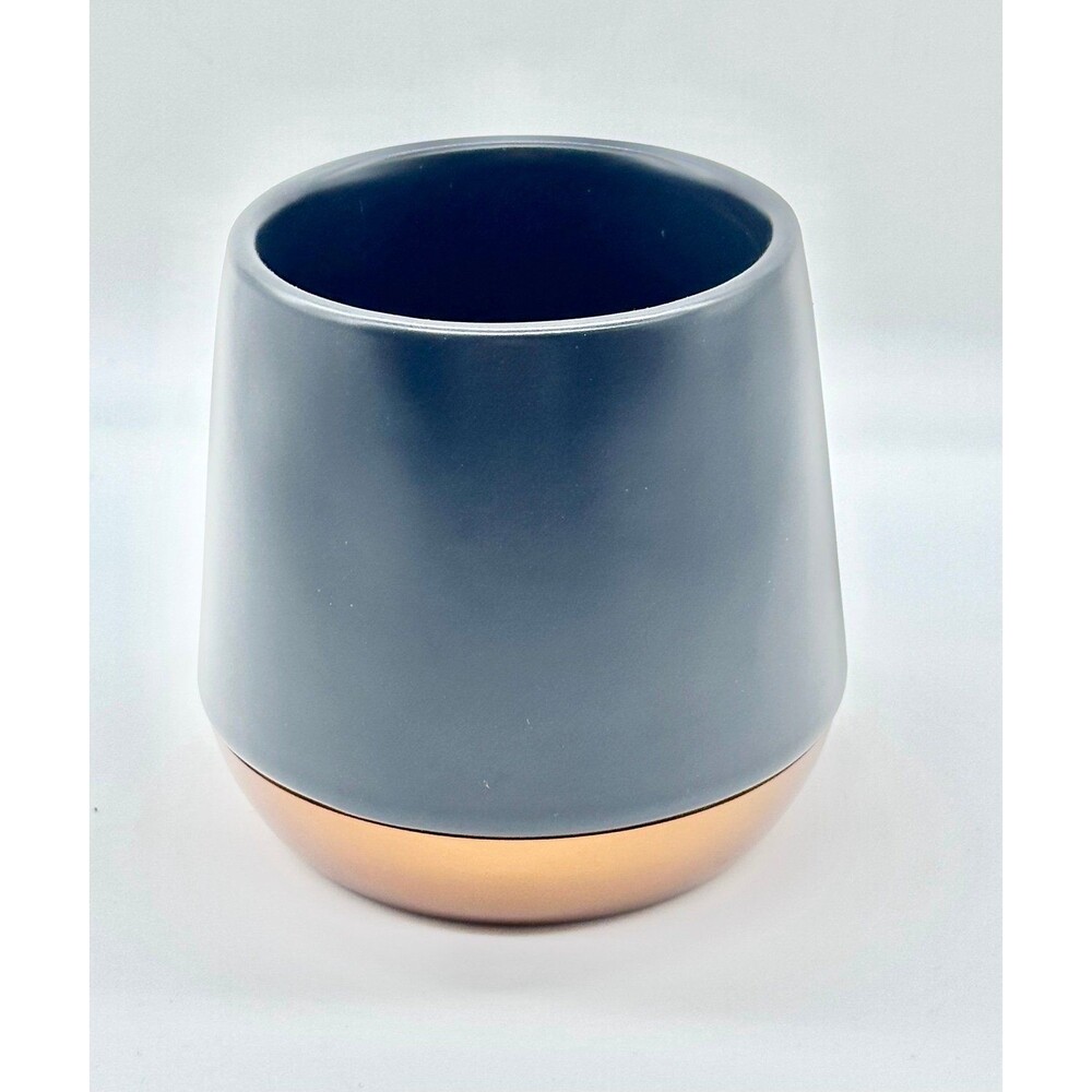 Fellow Joey Double Wall Ceramic Mug featuring a matte black body copper bottom